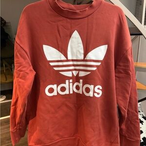 Adidas oversized crew neck in burnt orange.
